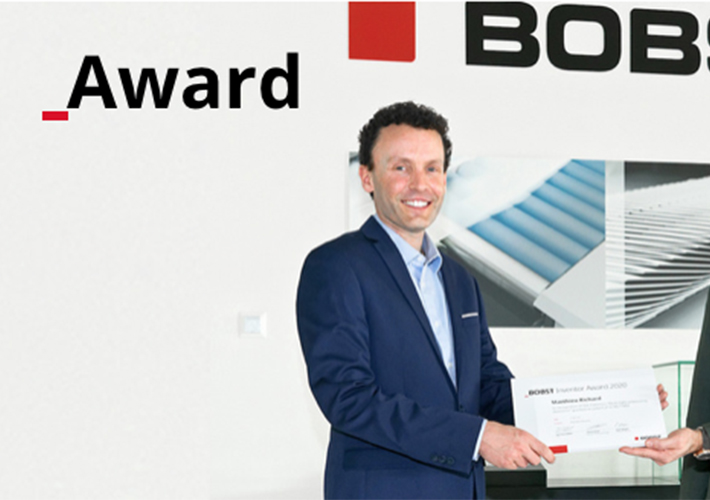 Foto BOBST recompensa a un empleado por inventar una revolucionaria tecnología de detección de grabado.
